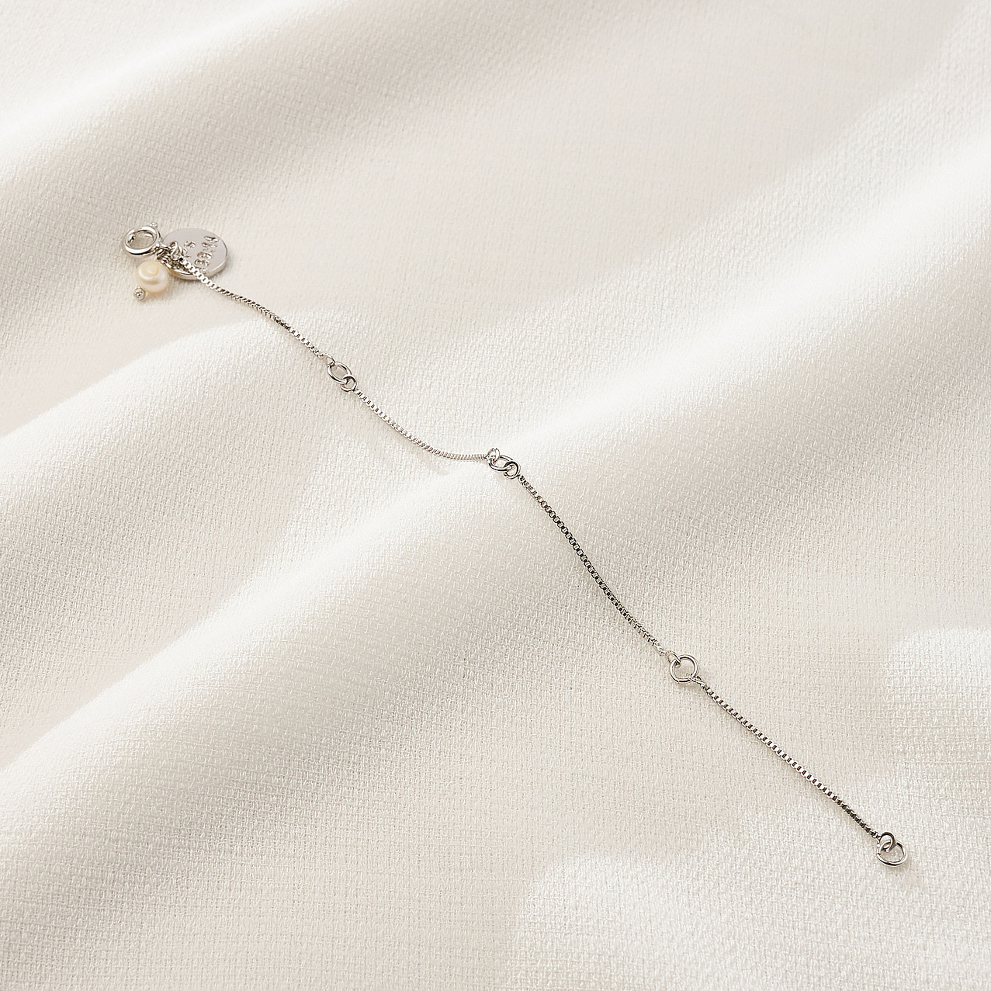 Extensor Thais Banho Ródio Branco