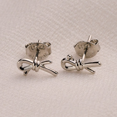 Brinco Dera Banho Ródio Branco